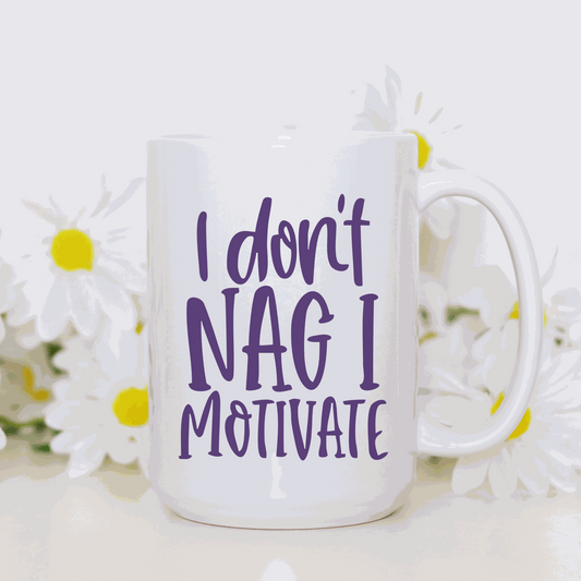 Humorous ceramic mug with "I Don't Nag I Motivate" message.