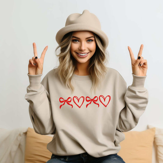Custom Coquette Bow & Heart Sweatshirt with red embroidered bows and hearts, perfect Valentine's or Mother's Day gift, available in S–2XL.