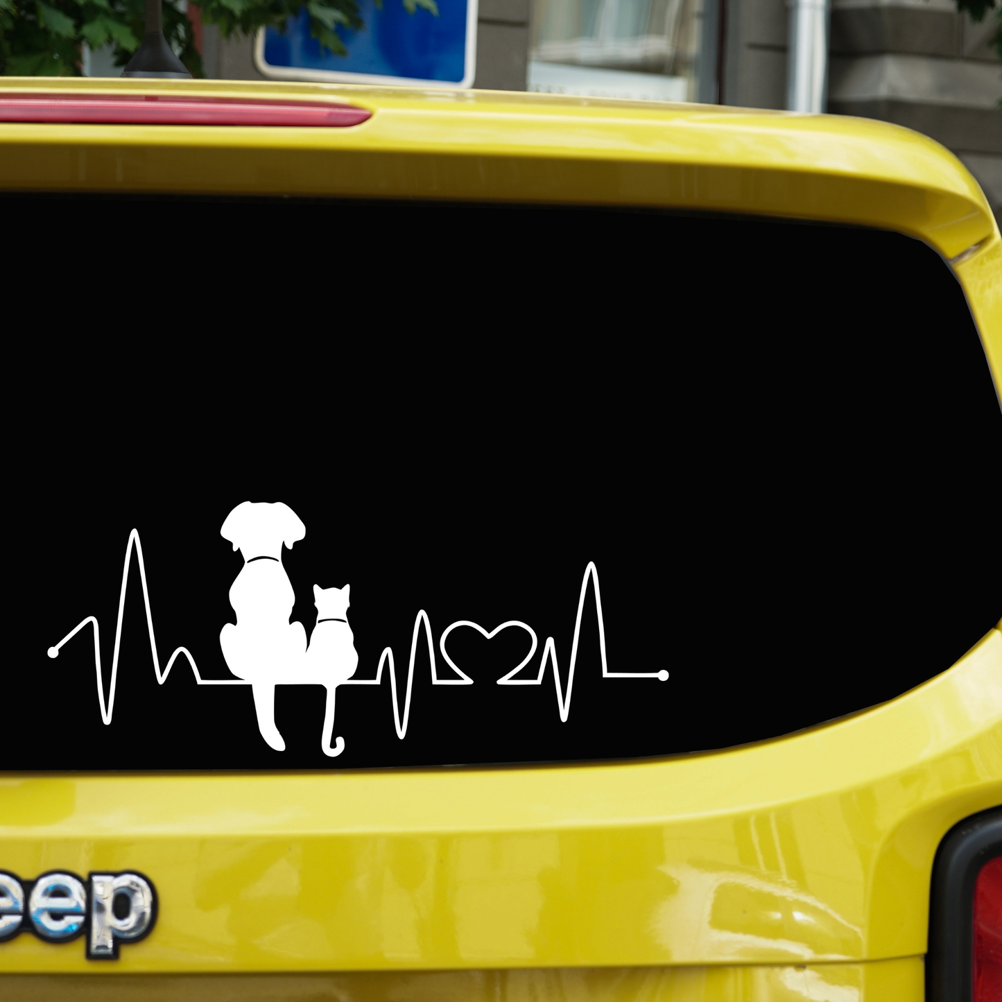Dog and cat heartbeat vinyl car decal in white on a yellow Jeep window