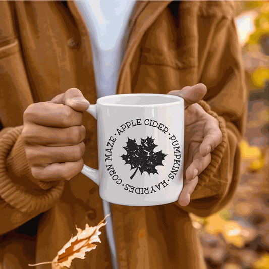 Fall themed ceramic coffee mug with pumpkin design, ideal for Halloween, available in 11 oz or 15 oz sizes.
