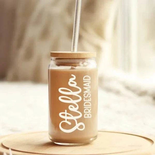 Personalized glass iced coffee cup with bamboo lid and straw.