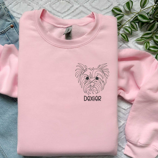 Pink classic crewneck sweater with custom embroidered Yorkshire Terrier face and pet name in block font Dexter