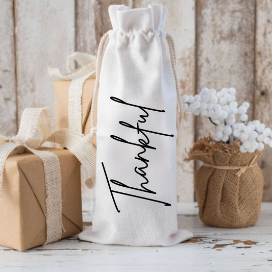 Custom holiday wine bag personalized with "Thankful" text, made of canvas, ideal wine gift for the festive season.