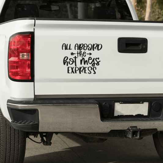 "All Aboard the Hot Mess Express" vinyl decal on white truck tailgate.