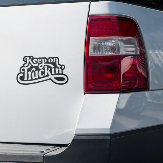Keep On Truckin Sticker on a white vehicle's rear, vinyl decal for cars and smooth surfaces.