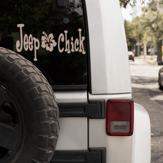 Jeep Chick vinyl decal on rear window of white Jeep.