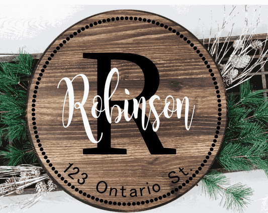 Custom family wood door sign with address and initial, featuring personalized design on knotty pine.