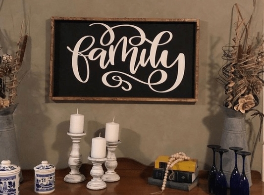 Handcrafted personalized family wood sign with white lettering on a black background, rustic farmhouse style.