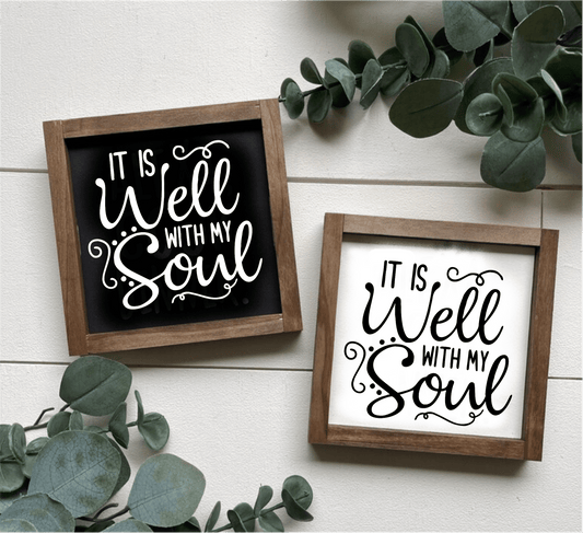 Handcrafted wood signs with "It is Well with My Soul" message in black and white designs.