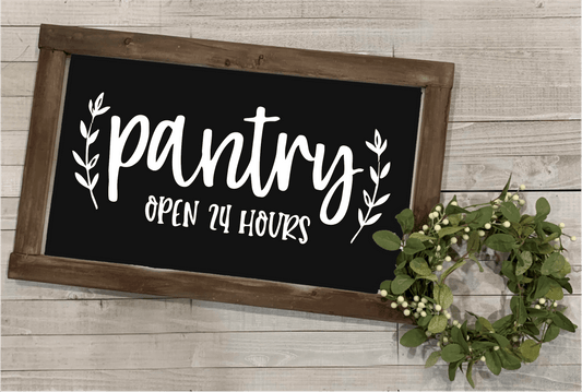 Wood framed pantry sign with "Pantry Open 24 Hours" in white lettering on a black background, farmhouse style decor.