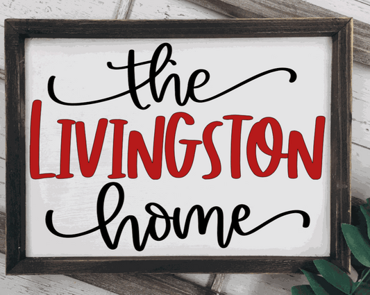 Framed wood family home name sign with personalized text.