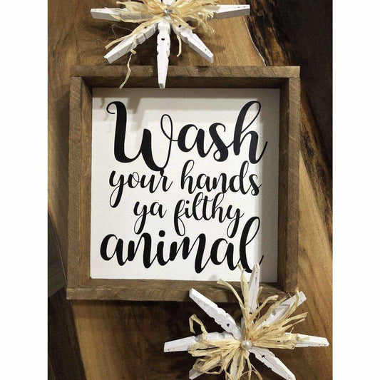 Framed wood sign with "Wash Your Hands Ya Filthy Animal" in black lettering on white background.