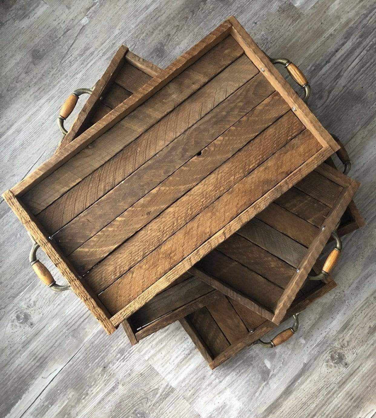 Rustic tobacco slat serving tray with handles on wood floor background