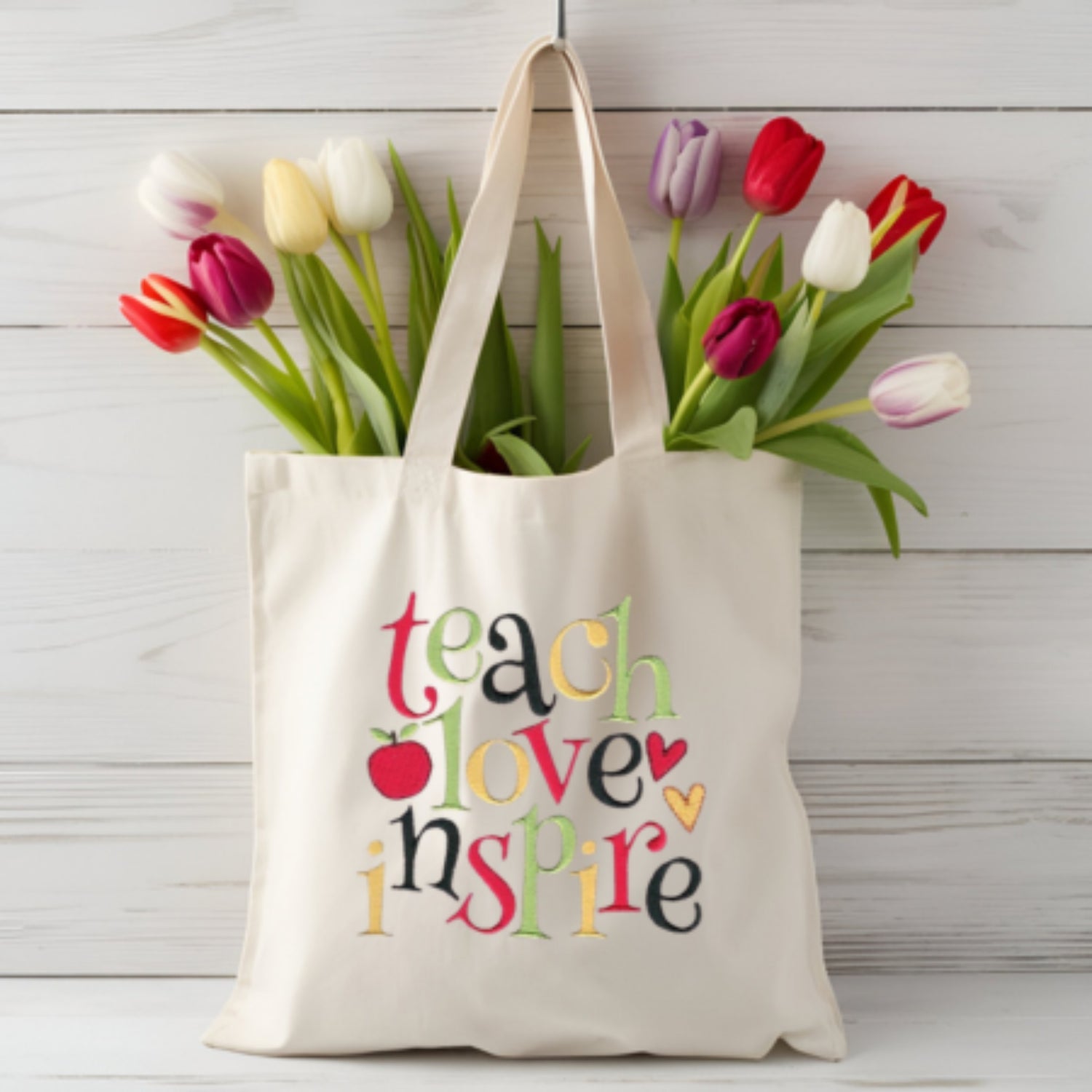 teach love inspire embroidered tote bag full of tulips made just for a teacher
