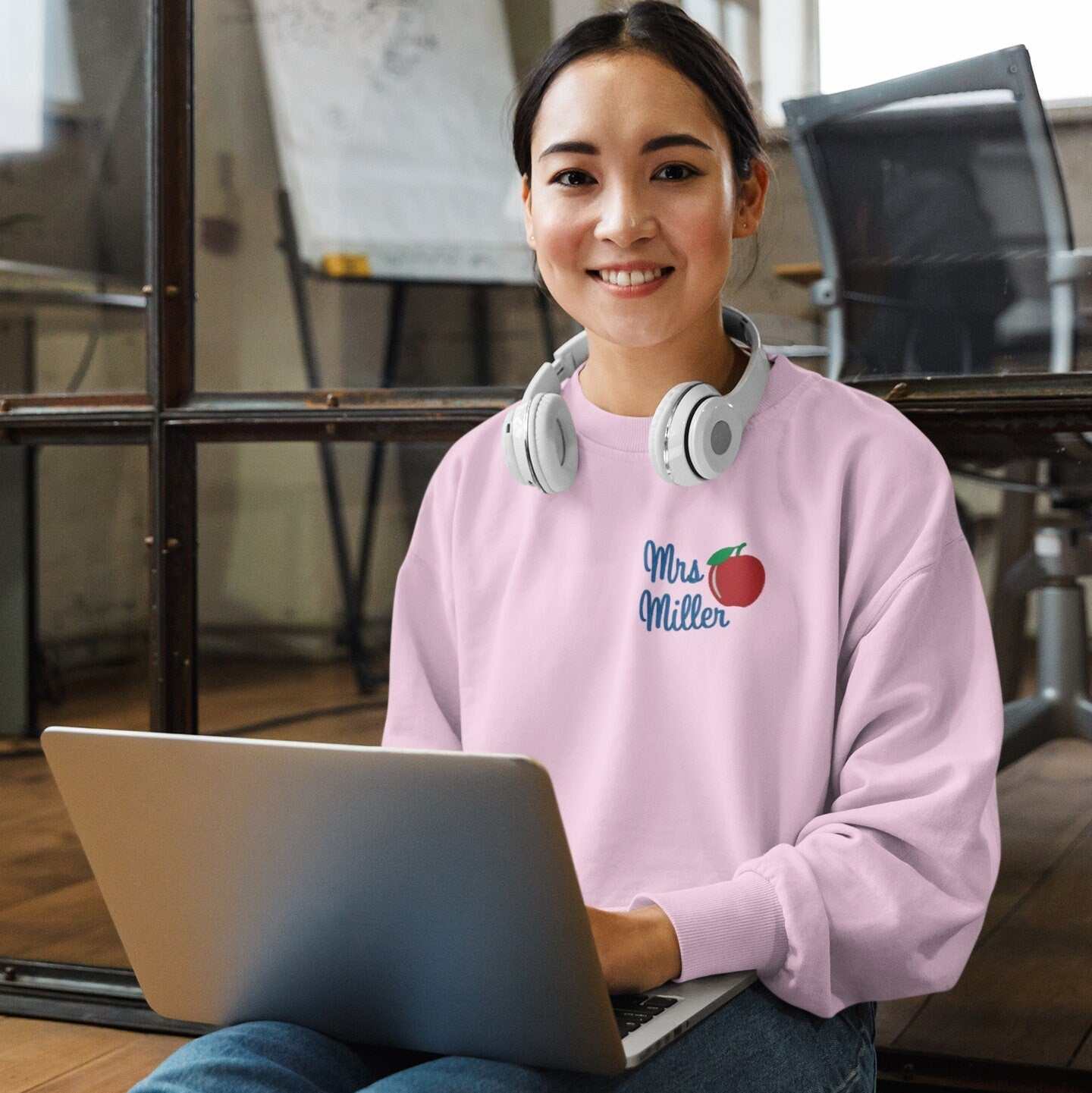 Personalized teacher sweatshirt with embroidered apple and custom name design