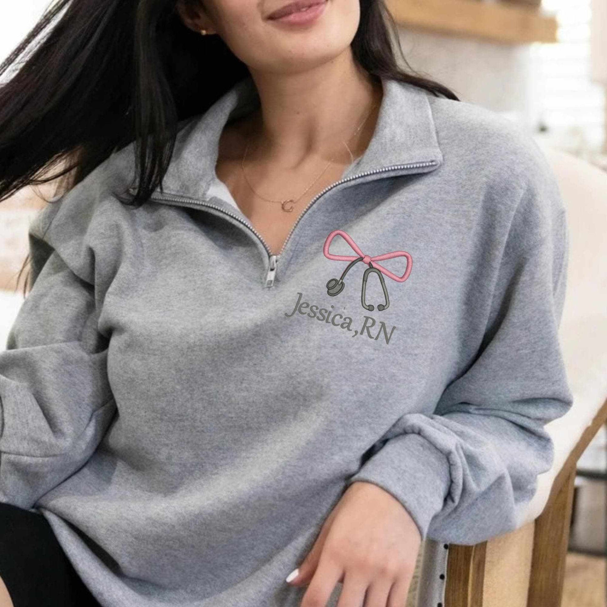 Embroidered Nurse Bow Sweatshirt personalized with name on ash quarter zip pullover for nurses