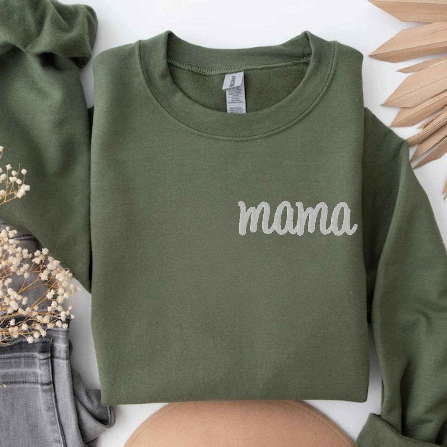 Personalized Mama sweatshirt with embroidered kids names on sleeves in custom thread color and font