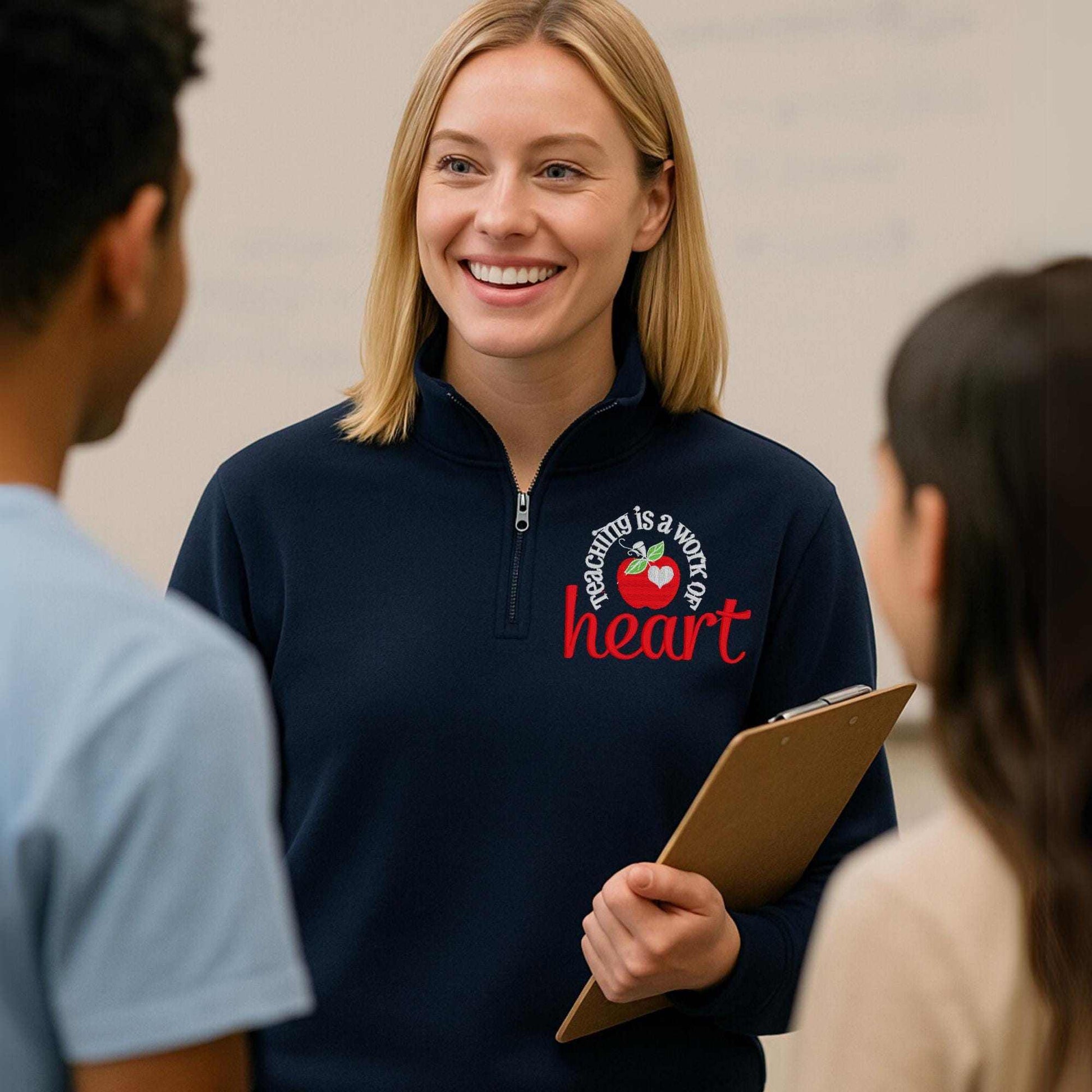 Teaching Is a Work of Heart embroidered sweatshirt with red apple design for teacher appreciation gift