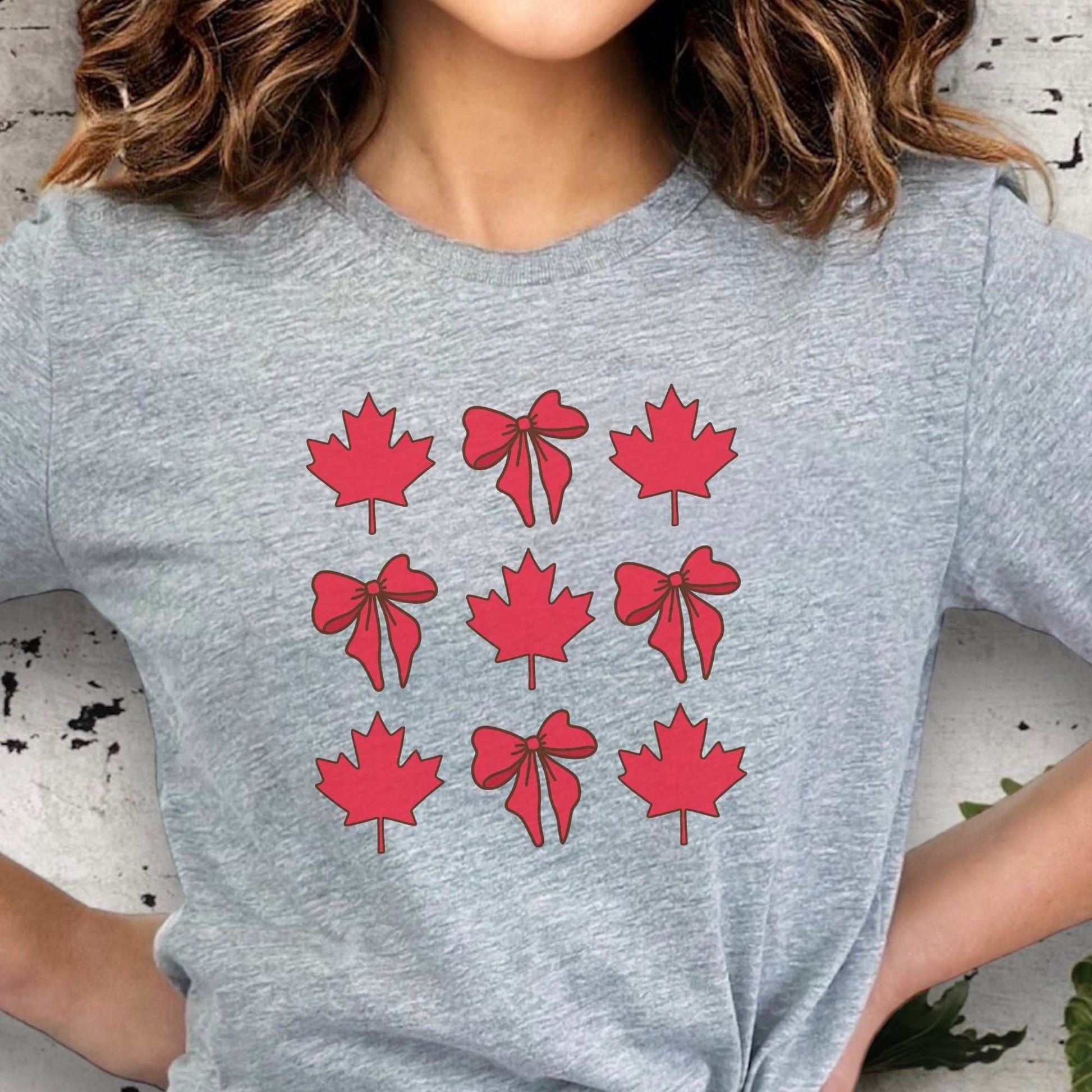 Unisex Canadian Maple Leaf & Ribbon T-Shirt celebrating Canada Day with vibrant symbols, ideal for casual and festive occasions.