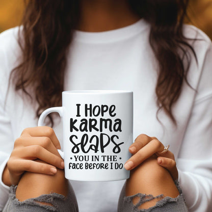 Witty ceramic coffee mug with "I Hope Karma Slaps You" design, 11 or 15 oz.
