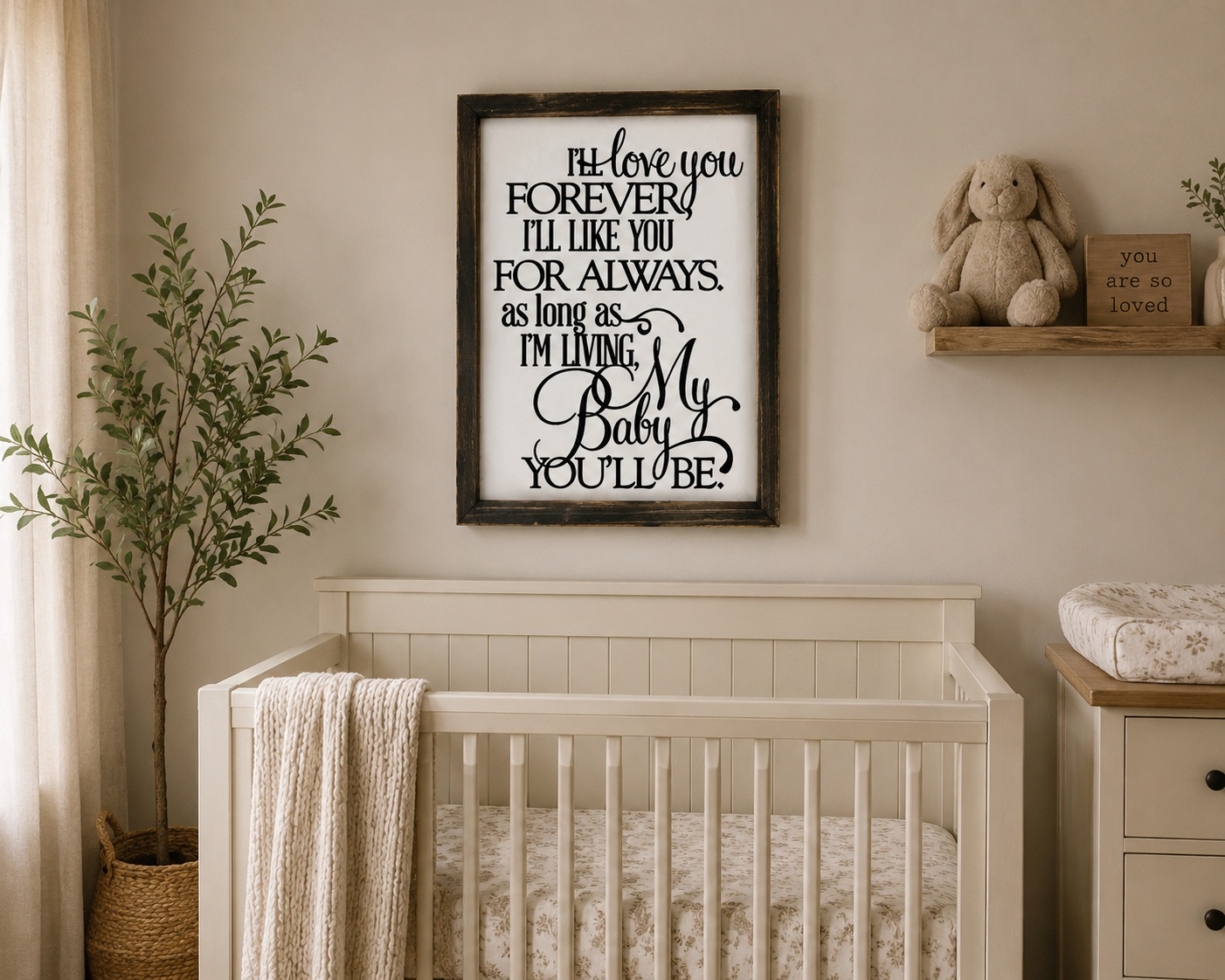 Nursery room with a crib, framed quote, and decorative items.