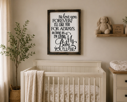 Nursery room with a crib, framed quote, and decorative items.