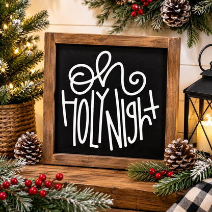 Decorative sign with 'Oh Holy Night' text in a wooden frame, surrounded by Christmas decorations.