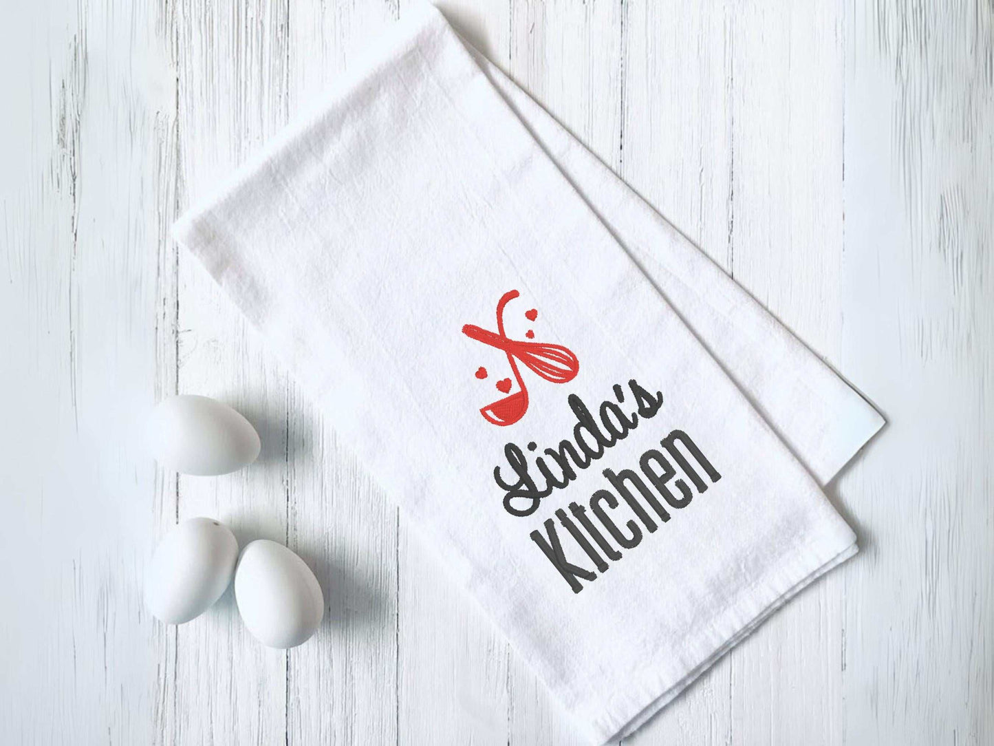 Personalized kitchen towel with custom name and embroidered whisk and spoon design in choice of thread color