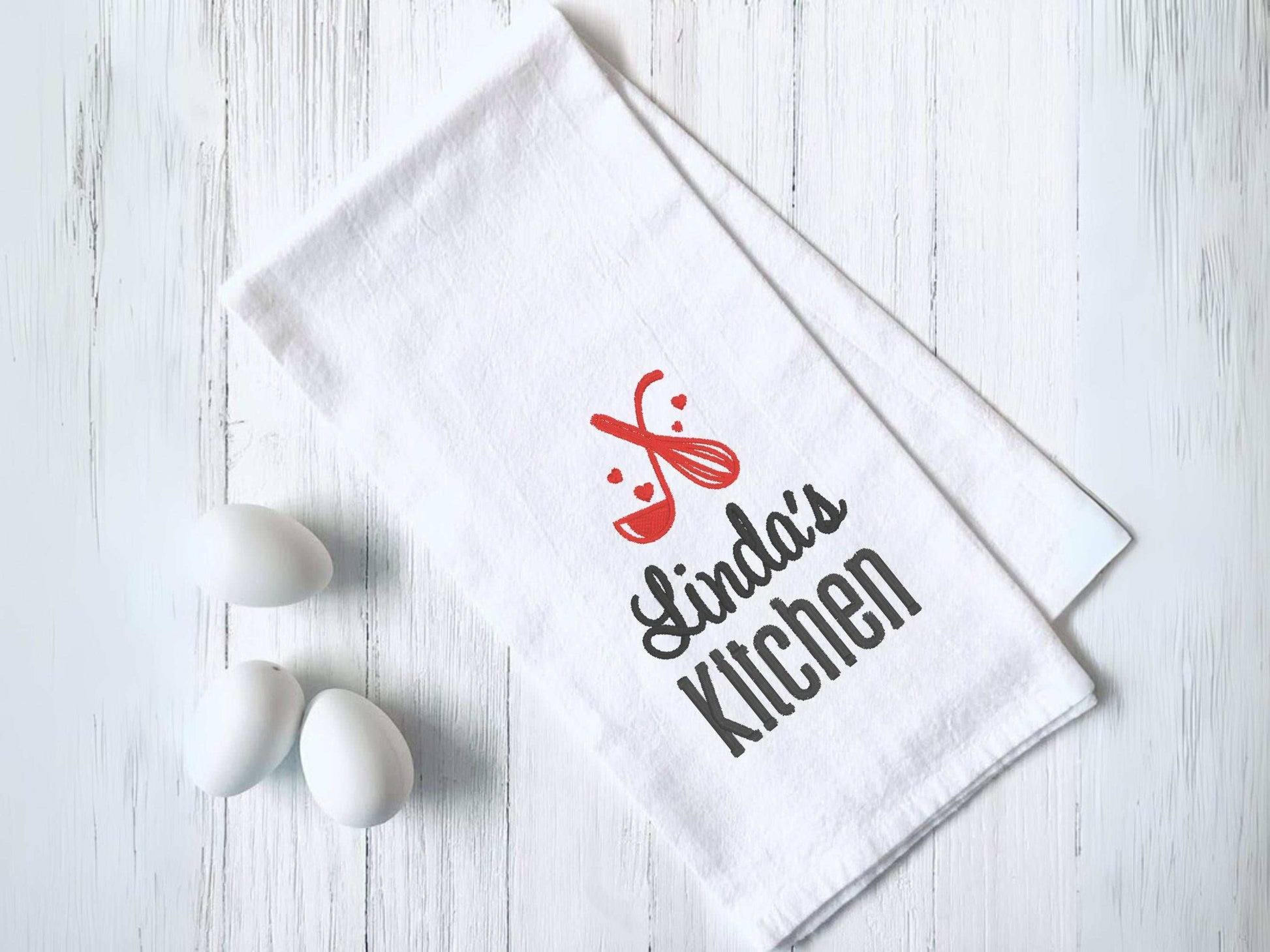 Personalized kitchen towel with custom name and embroidered whisk and spoon design in choice of thread color