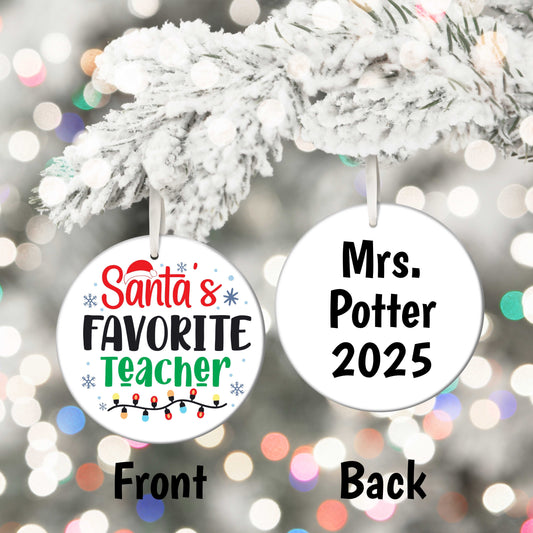 Santa’s Favourite Teacher personalized ceramic Christmas ornament with festive design and name/year on back hanging on snowy tree branch