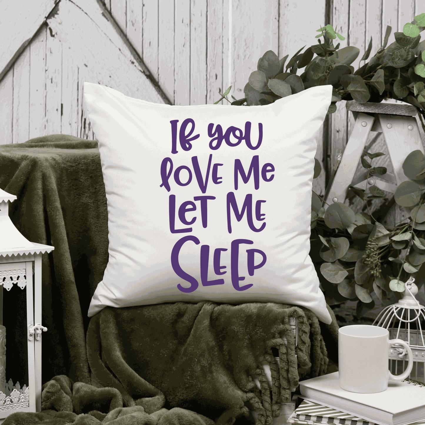 Humorous cotton pillow cover with "If You Love Me Let Me Sleep" saying, available in two sizes.