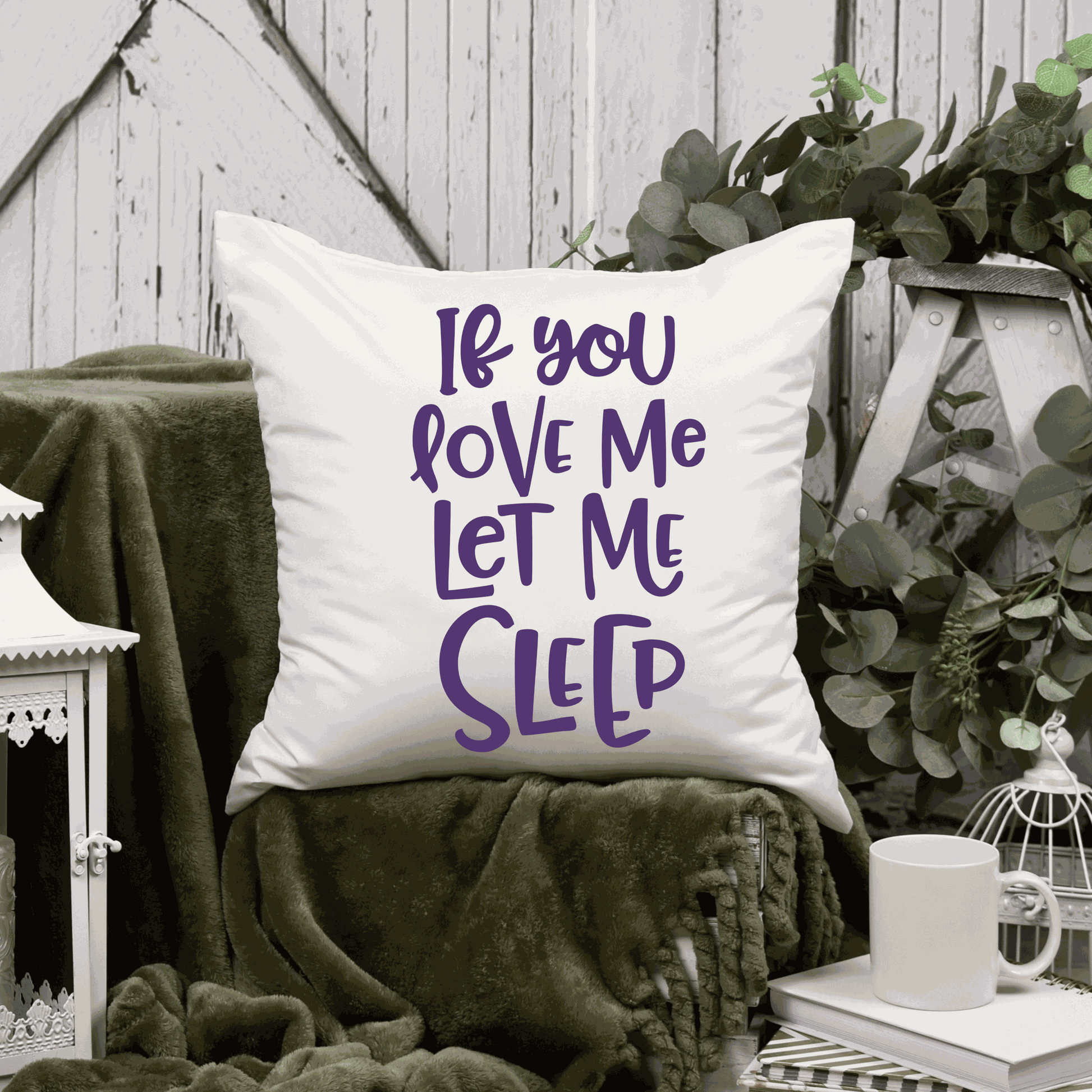Humorous cotton pillow cover with "If You Love Me Let Me Sleep" saying, available in two sizes.