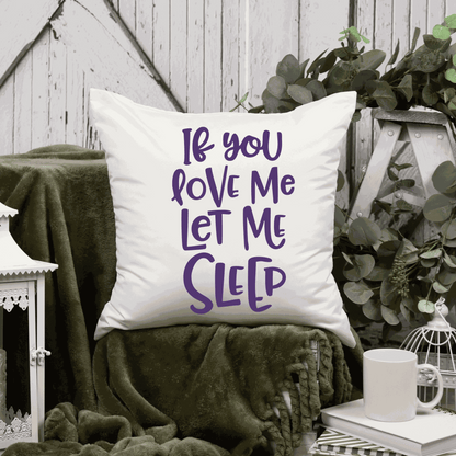 Humorous cotton pillow cover with "If You Love Me Let Me Sleep" saying, available in two sizes.