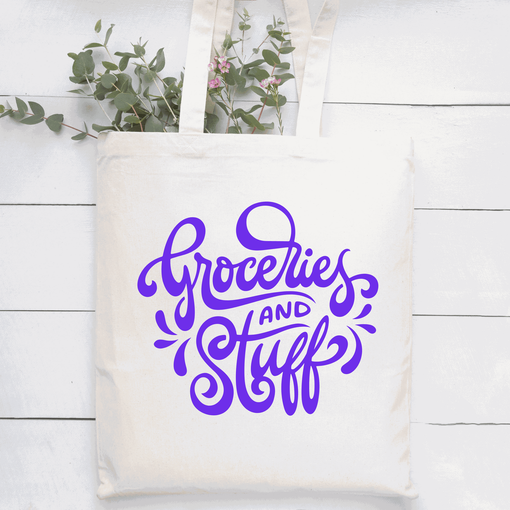 Cotton canvas tote bag with "Groceries and Stuff" design in purple, reusable and environmentally friendly.