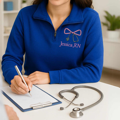 Embroidered Nurse Bow Sweatshirt personalized with name on ash-colored quarter zip pullover for nurse appreciation gift