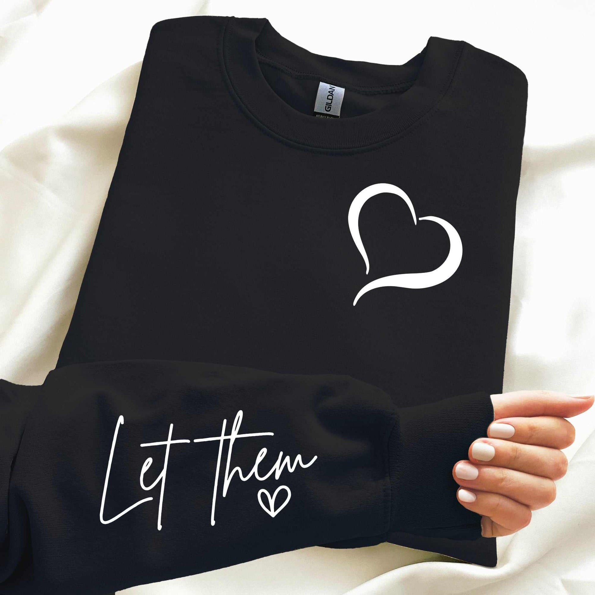 "Let Them Embroidered Cozy Sweatshirt" with heart detail and affirmation text; ideal for emotional wellness and personal growth.