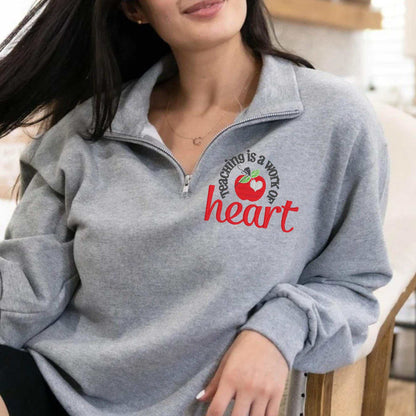 Teaching Is a Work of Heart embroidered sweatshirt with red apple design for teacher appreciation gift