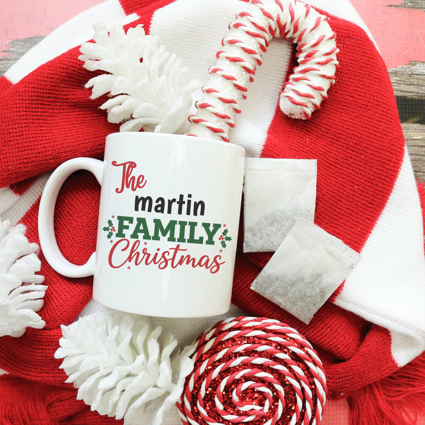 Custom family Christmas mug with personalized family name in festive design, 15oz white enamel, dishwasher and microwave safe