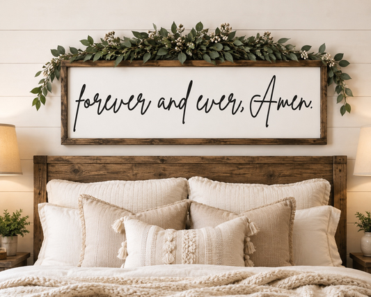 Bedroom with wooden headboard, decorative pillows, and a framed sign above reading 'forever and ever, Amen'.