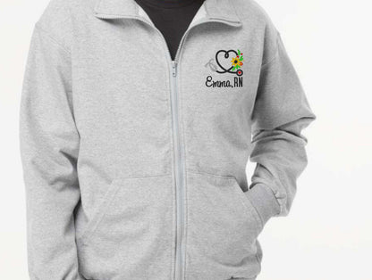Custom nurse full zip sweatshirt with embroidery, ideal for RN graduation gift, unisex sizing.