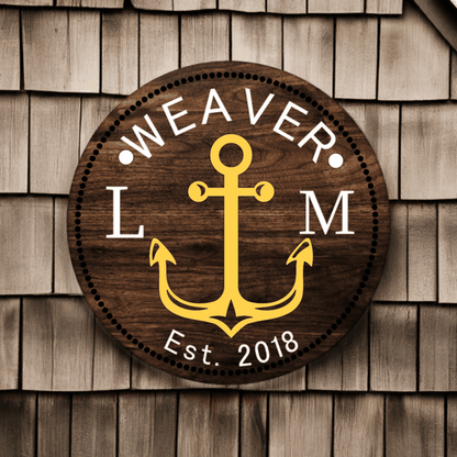 Custom family wood door sign with anchor design and personalized name on wooden shingles.