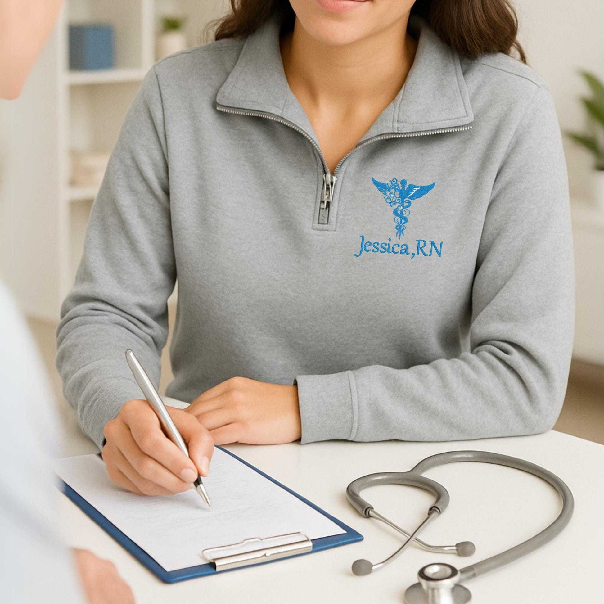 Nurse embroidered quarter zip sweatshirt with custom name and medical symbol