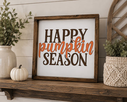 Decorative sign with 'Happy Pumpkin Season' text on a wooden shelf with plants and pumpkins.