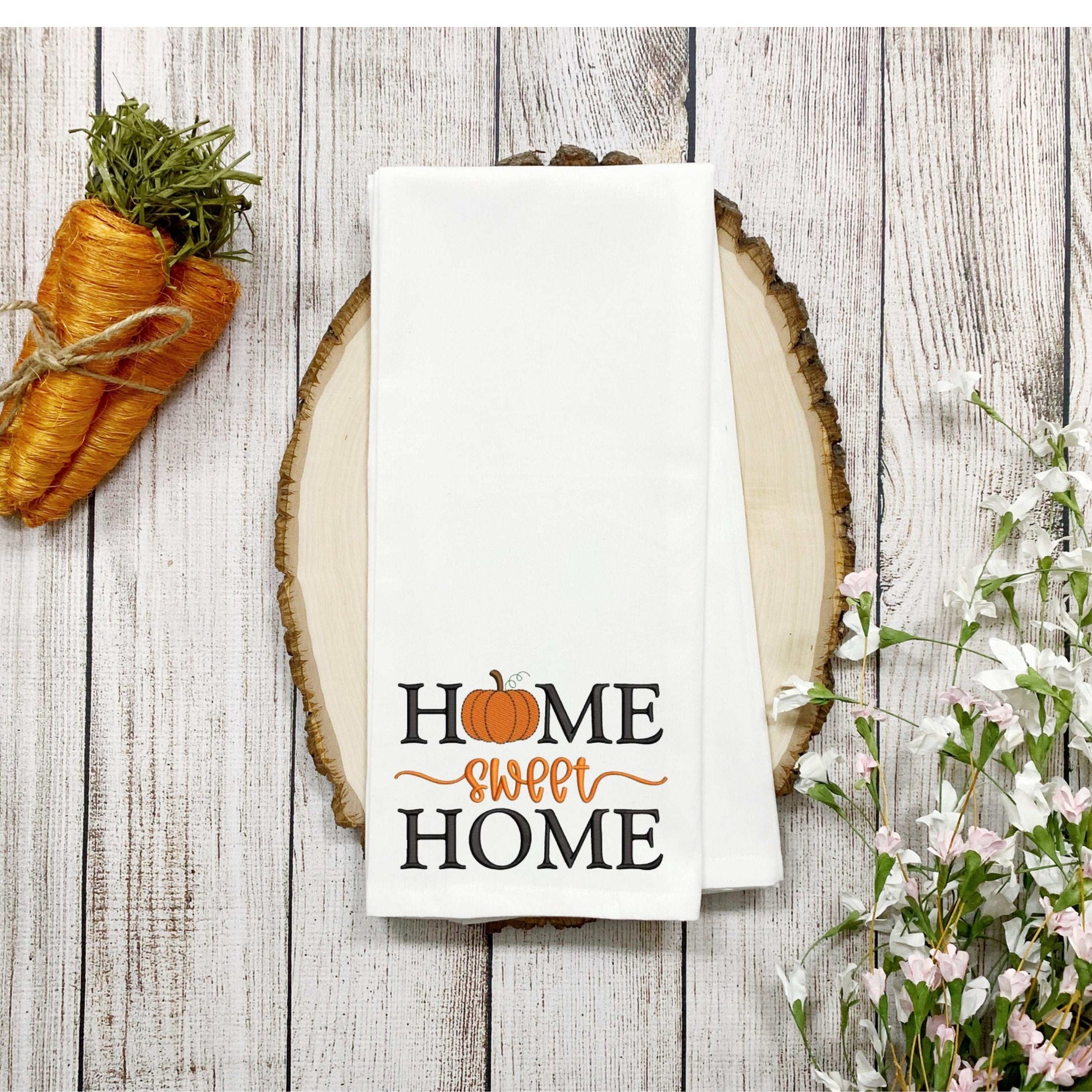Thanksgiving embroidered tea towel with "Home Sweet Home" and pumpkin design on 100% cotton fabric.