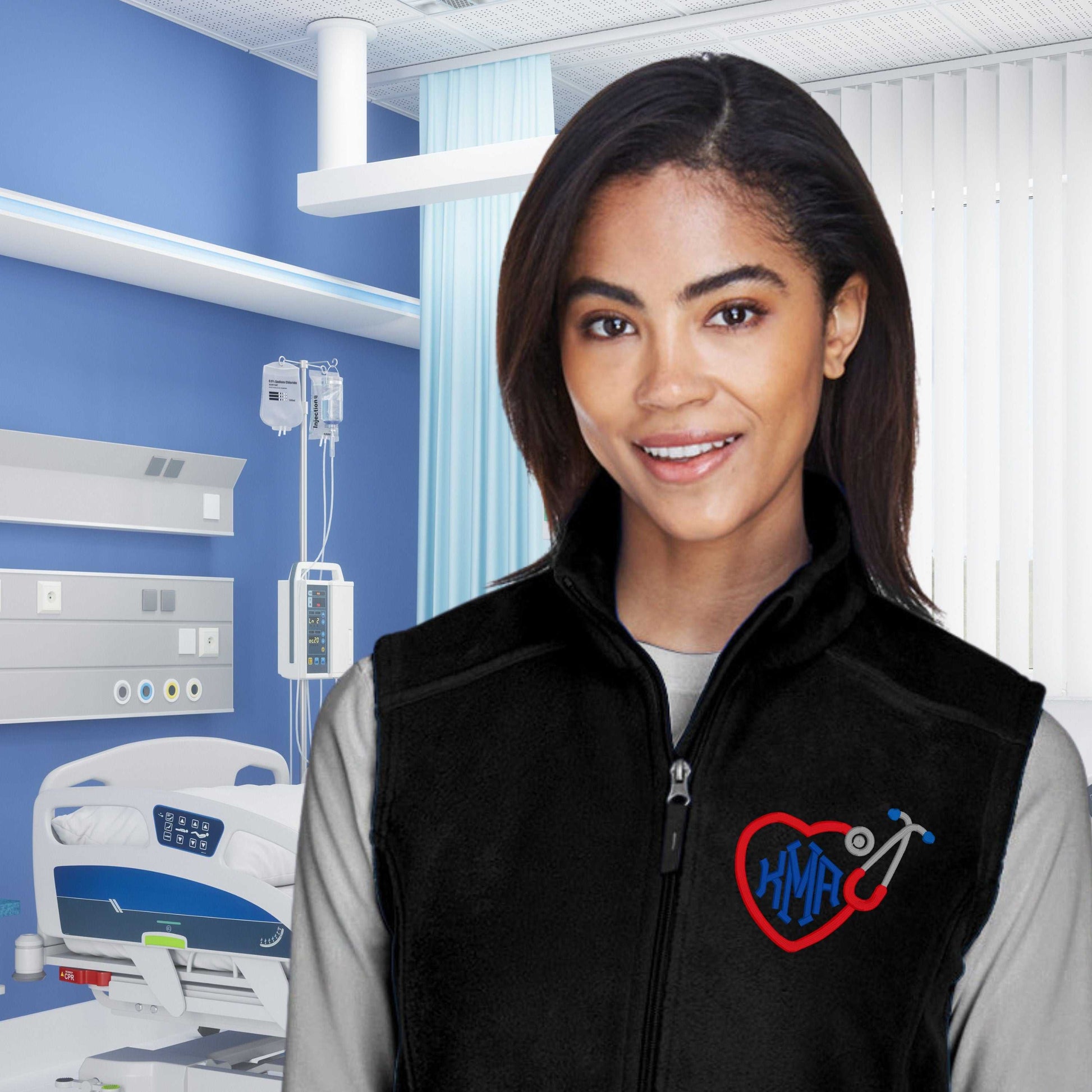 Custom RN embroidered fleece vest in black, personalized nurse gift, modeled in a hospital setting.