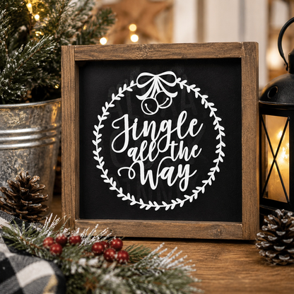 Decorative sign with 'Jingle all the Way' text in a wooden frame, surrounded by Christmas decor.