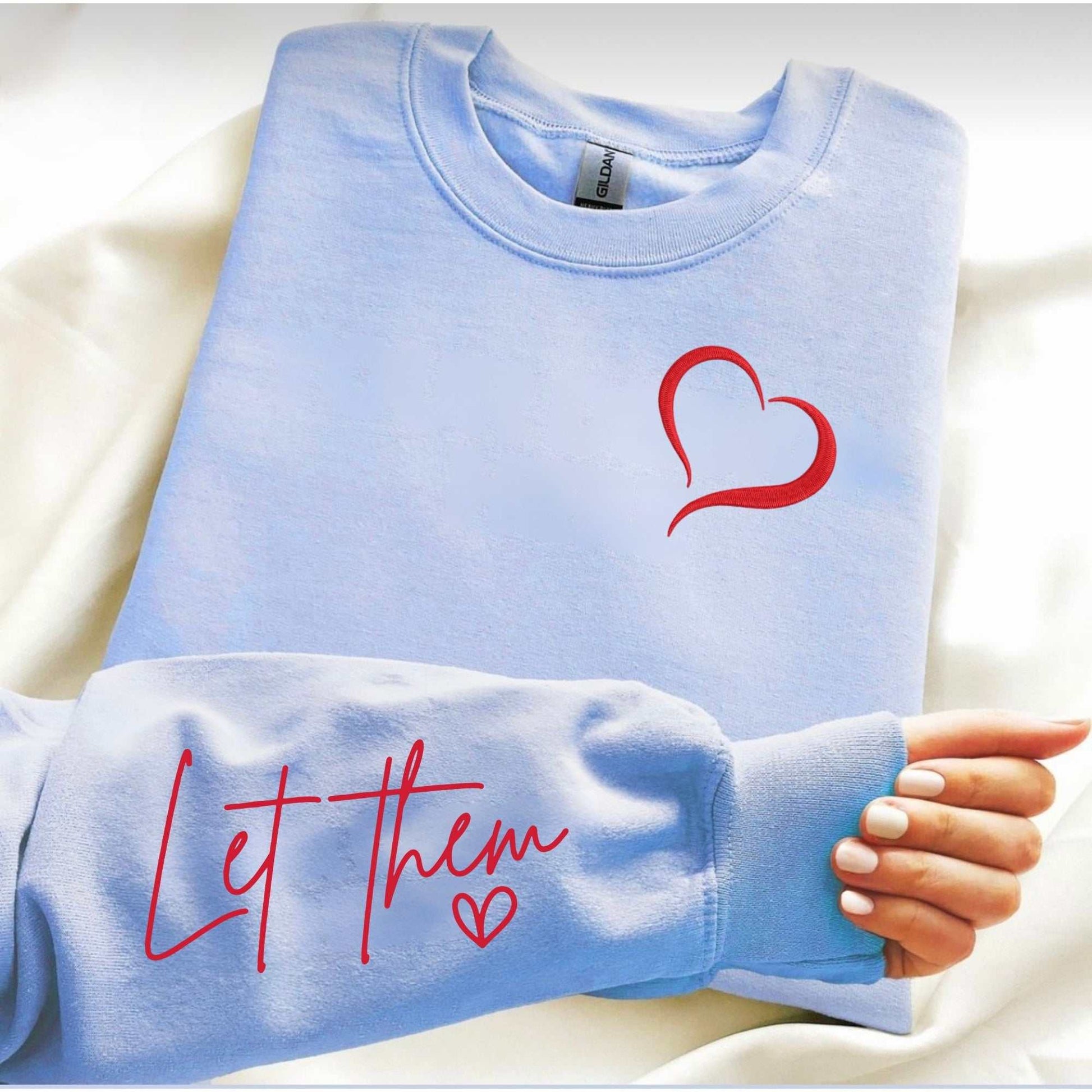 Embroidered cozy sweatshirt with "Let Them" message and heart