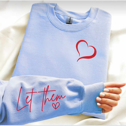 Embroidered cozy sweatshirt with "Let Them" message and heart