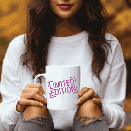 Limited edition ceramic inspirational mug held by a person in a cozy outdoor setting.