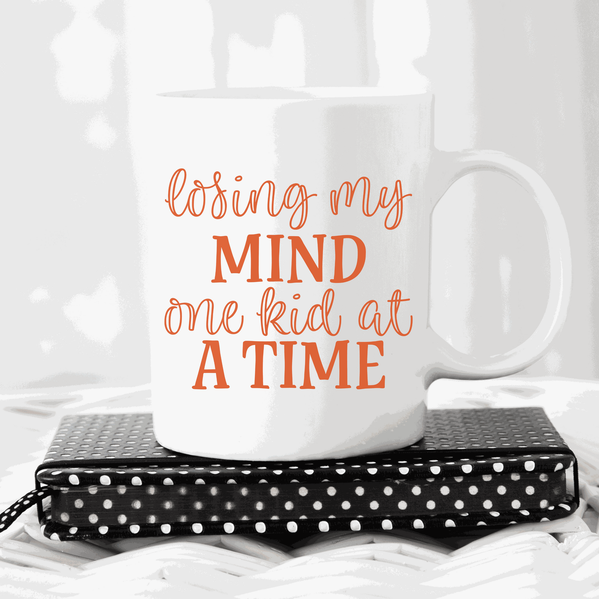 "Losing my Mind one Kid at a Time" ceramic mug, humorous gift for moms, 15 oz, white glossy finish.